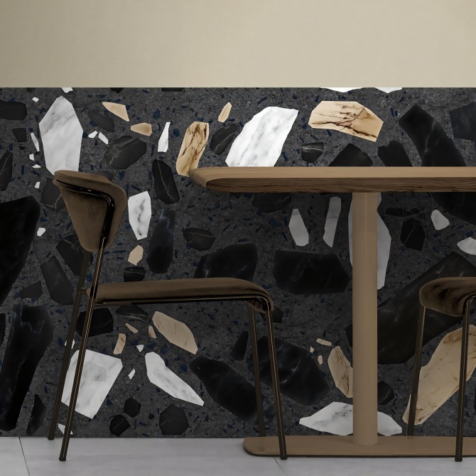 Terrazo Correr. Vinilo lavable para paredes y zócalos. De color gris oscuro con piedras negras, blancas y tierra. Lokoloko