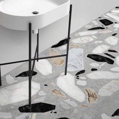 Terrazo Celestia- Vinilo lavable para suelo, en baño o cocinas, con piedras en blanco, negro y tierra, sobre un fondo gris.
