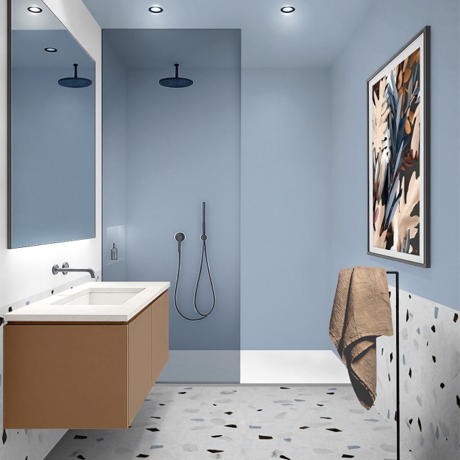 Baño moderno con vinilo adhesivo azul pastel en la ducha, resistente a la humedad y antibacterias.