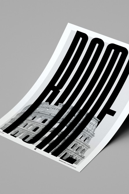 Print of the Roman Colosseum with vertical black letters in a modern bedroom above a contemporary headboard. Lokoloko design.